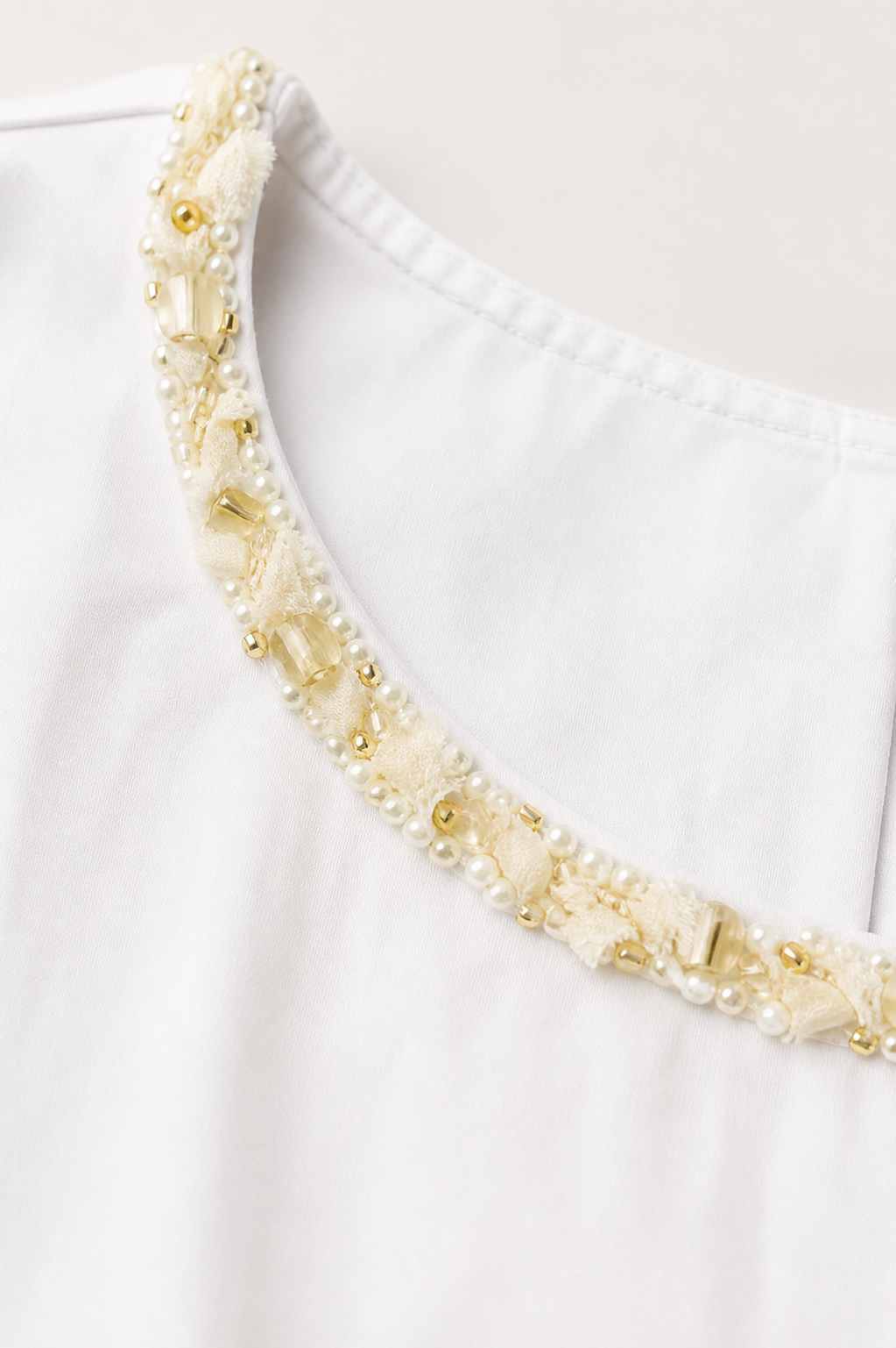 Elara Embellished Neck Bubble Hem Top